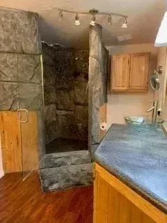 Overhead view of newly installed tile shower with slate flooring and waterproofing membrane