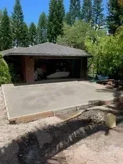 Newly poured concrete driveway with finished edges and proper grading